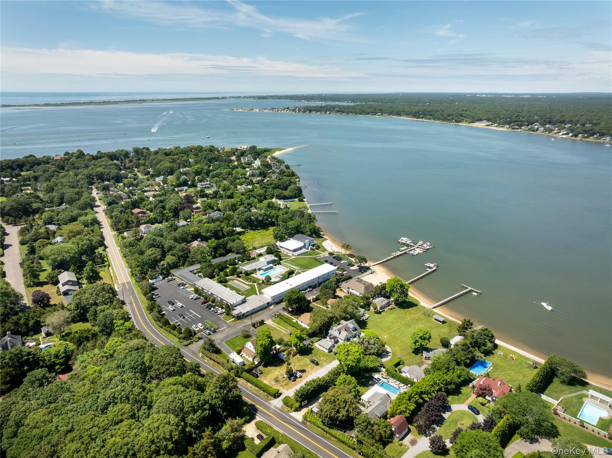 46 Rampasture Road, Unit 3 Hampton Bays, NY 11946 - Photo 24 of 29 a view of a lake with a city