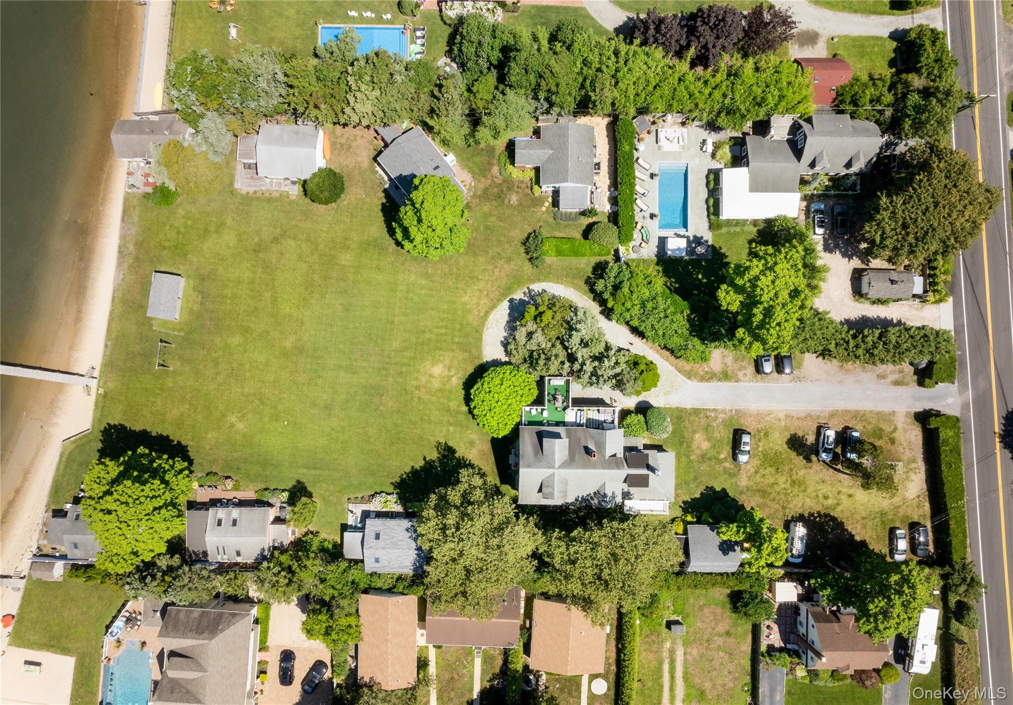 46 Rampasture Road, Unit 3 Hampton Bays, NY 11946 - Photo 25 of 29 an aerial view of a residential house with outdoor space