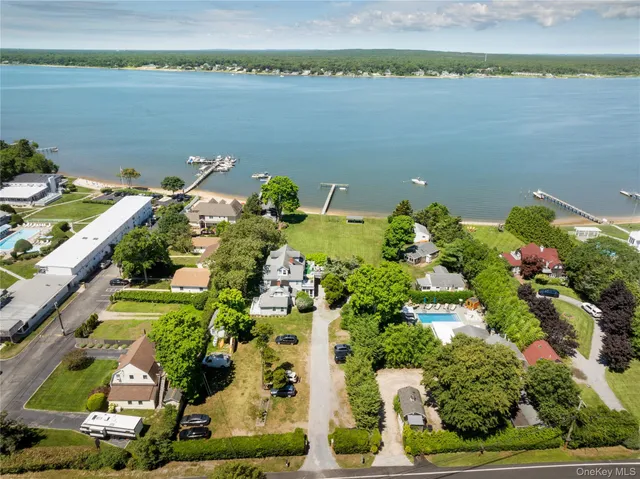 an aerial view of a house with a lake view