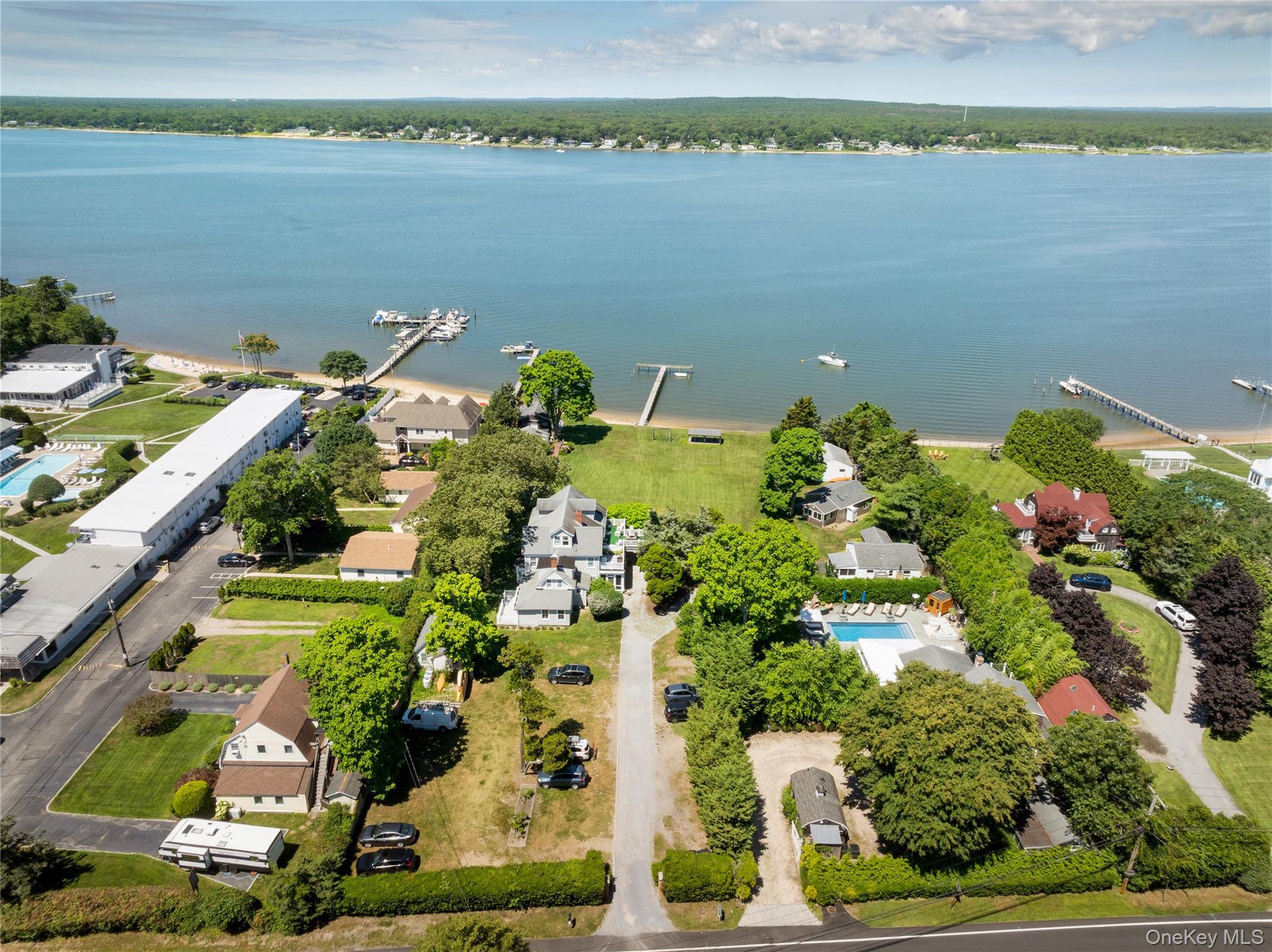 46 Rampasture Road, Unit 3 Hampton Bays, NY 11946 - Photo 26 of 29 an aerial view of a house with a lake view