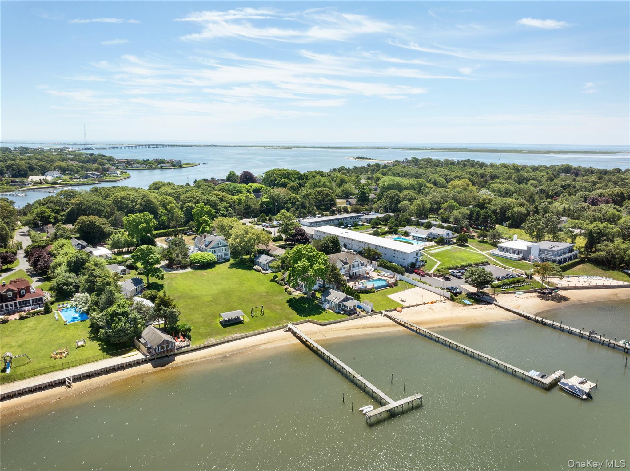 46 Rampasture Road, Unit 3 Hampton Bays, NY 11946 - Photo 5 of 29 an aerial view of residential houses with outdoor space