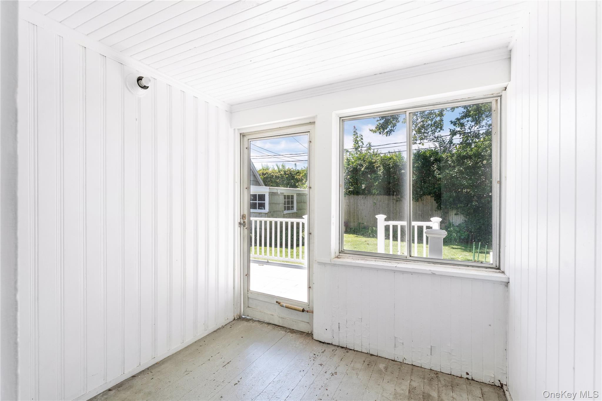 46 Rampasture Road, Unit 3 Hampton Bays, NY 11946 - Photo 6 of 29 a view of a room with a large window
