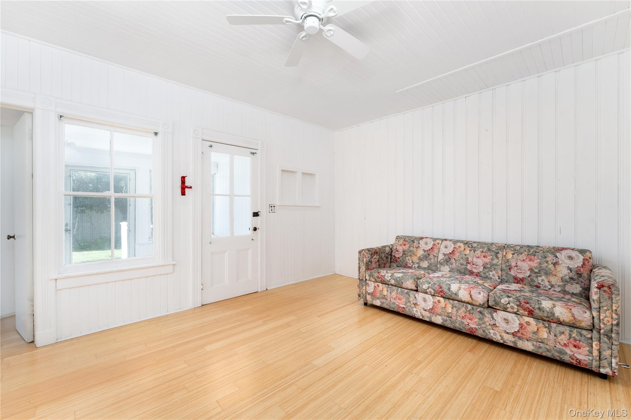 46 Rampasture Road, Unit 3 Hampton Bays, NY 11946 - Photo 8 of 29 a living room with furniture and a window