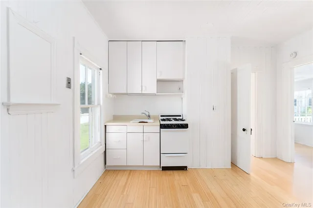 a kitchen with stainless steel appliances a refrigerator and a stove