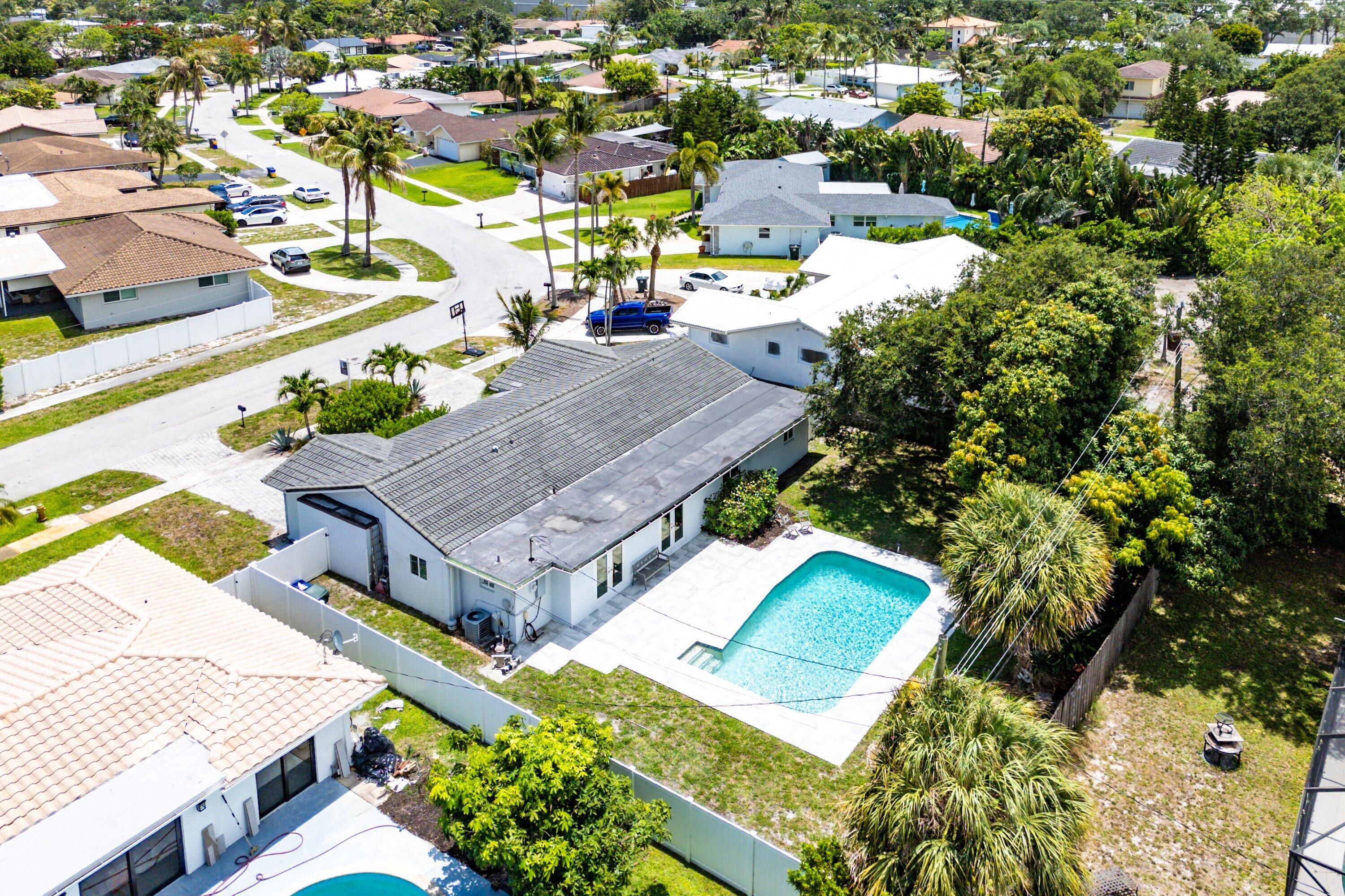 581 Northwest 13th Drive Boca Raton, FL 33486 - Photo 34 of 39 an aerial view of a house with a swimming pool