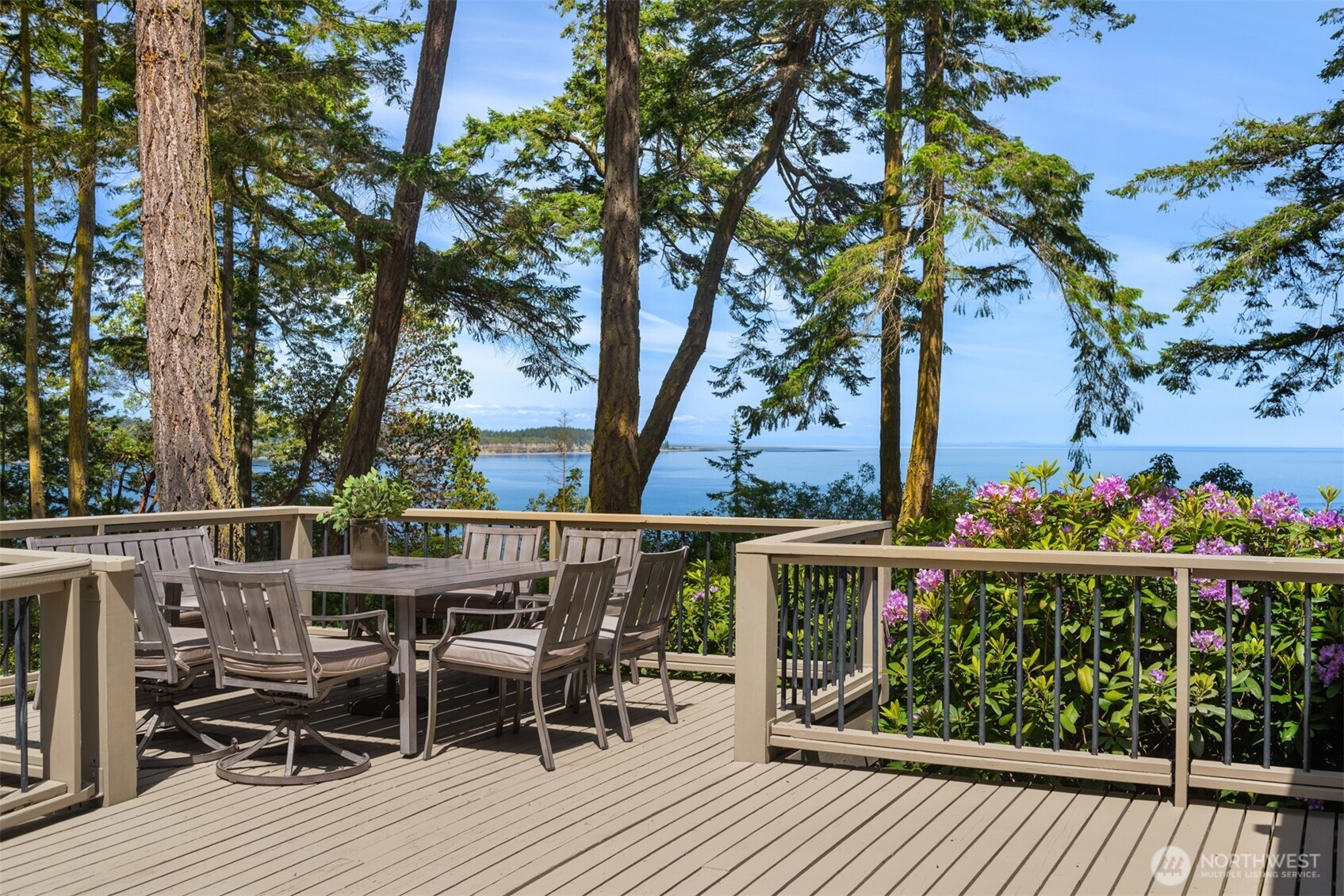 4065 East Sequim Bay Road, Unit 12 Sequim, WA 98382 - Photo 15 of 40 a view of a balcony with chairs and wooden floor