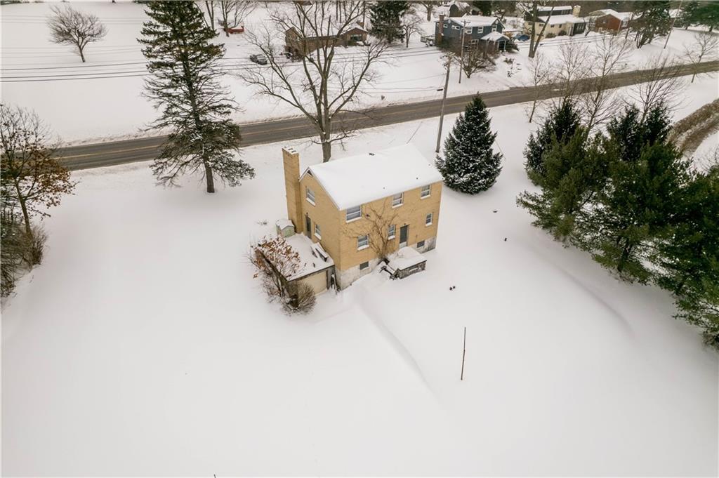 2573 Nicholson Road Sewickley, PA 15143 - Photo 2 of 18 an aerial view of a house with outdoor space and trees in the back