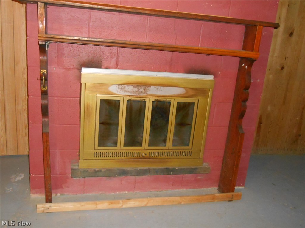 3206 Lake Road West Ashtabula, OH 44004 - Photo 25 of 25 FIREPLACE IN BASEMENT ROOM