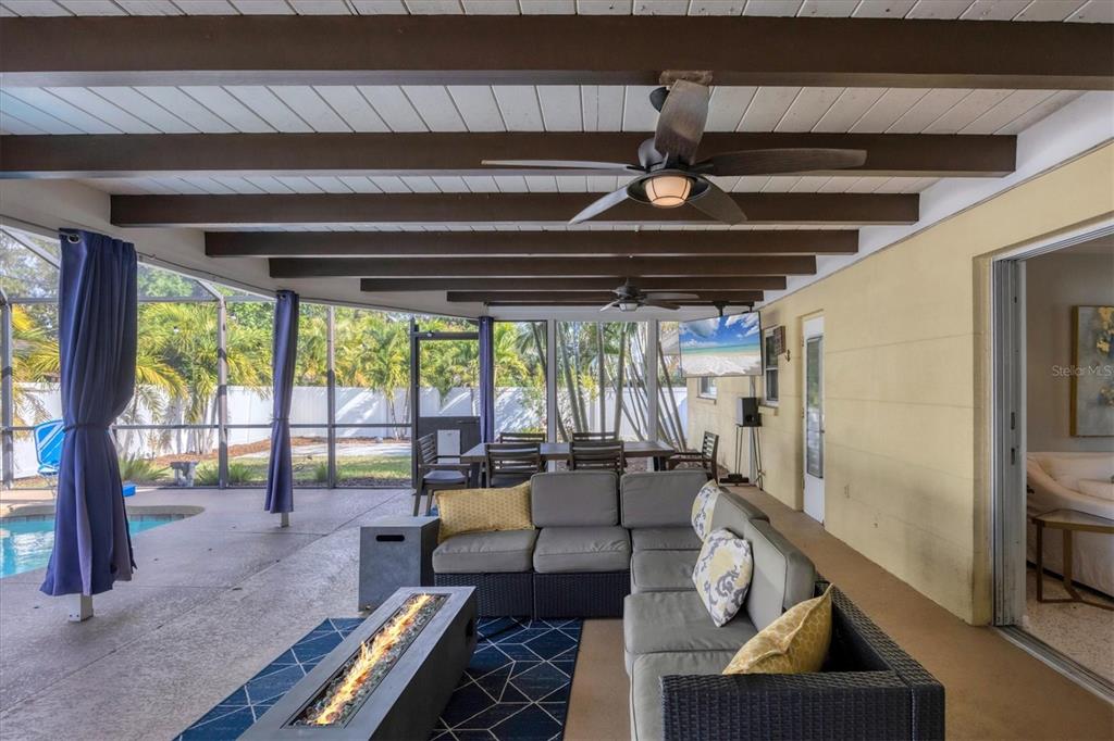 2927 Webber Street Sarasota, FL 34239 - Photo 22 of 27 a living room with furniture and a floor to ceiling window