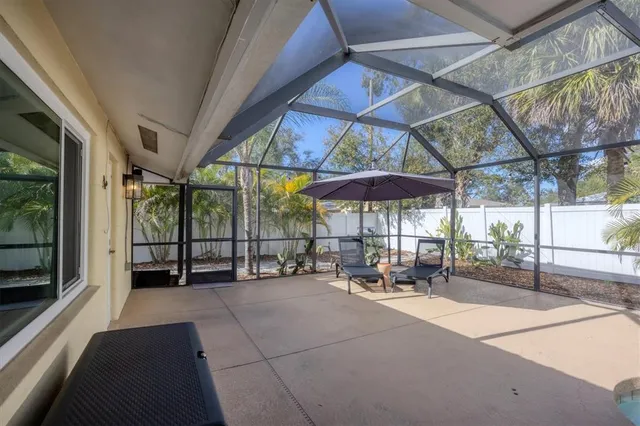 a view of swimming pool with a patio