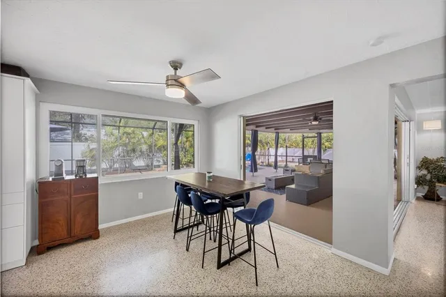 a view of a dining room with furniture window and outside view