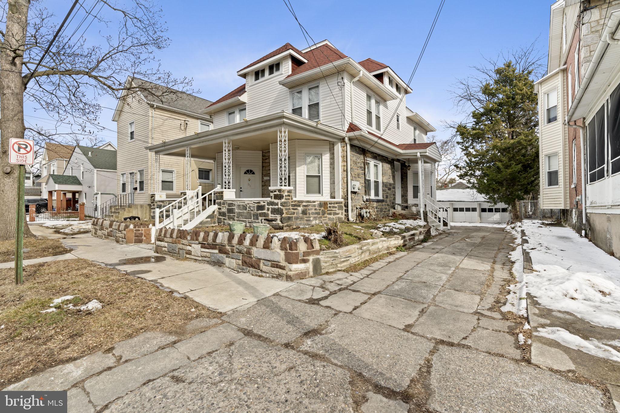 a view of a white building with large windows