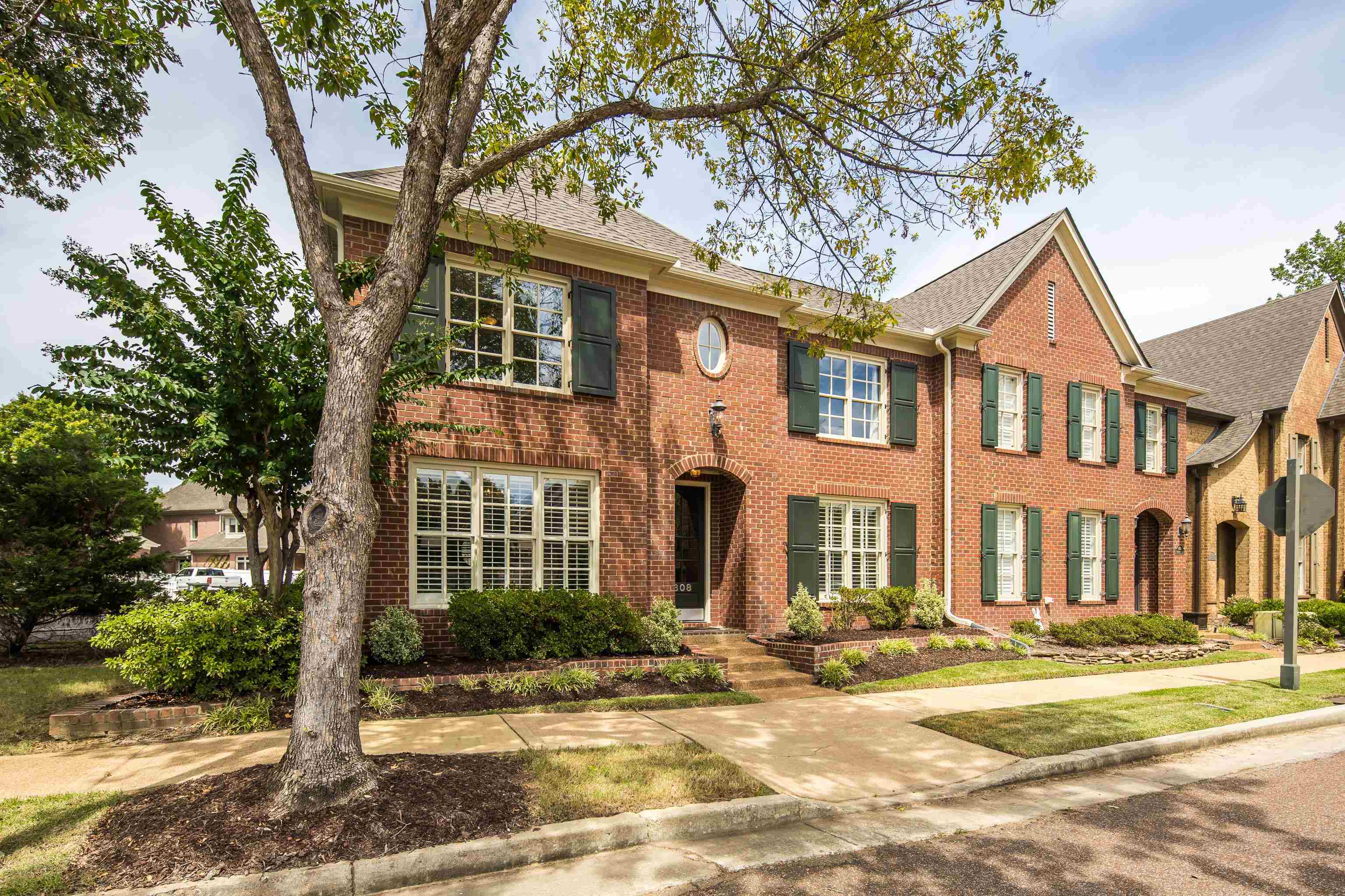 808 Deloach Lane Collierville, TN 38017 - Photo 1 of 40 a front view of a residential apartment building with a yard
