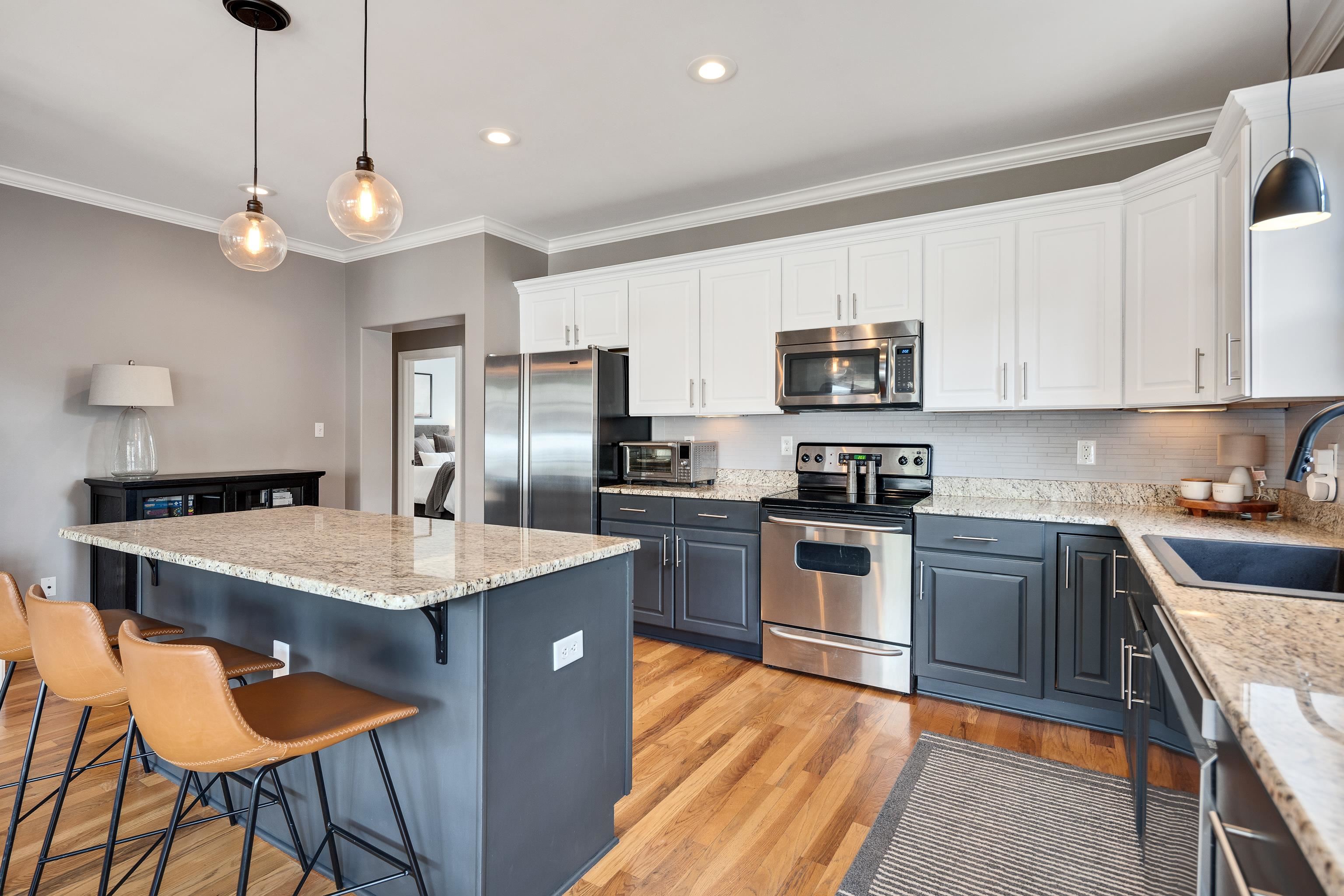 808 Deloach Lane Collierville, TN 38017 - Photo 11 of 40 a kitchen with stainless steel appliances granite countertop a stove top oven a refrigerator a sink and a stove
