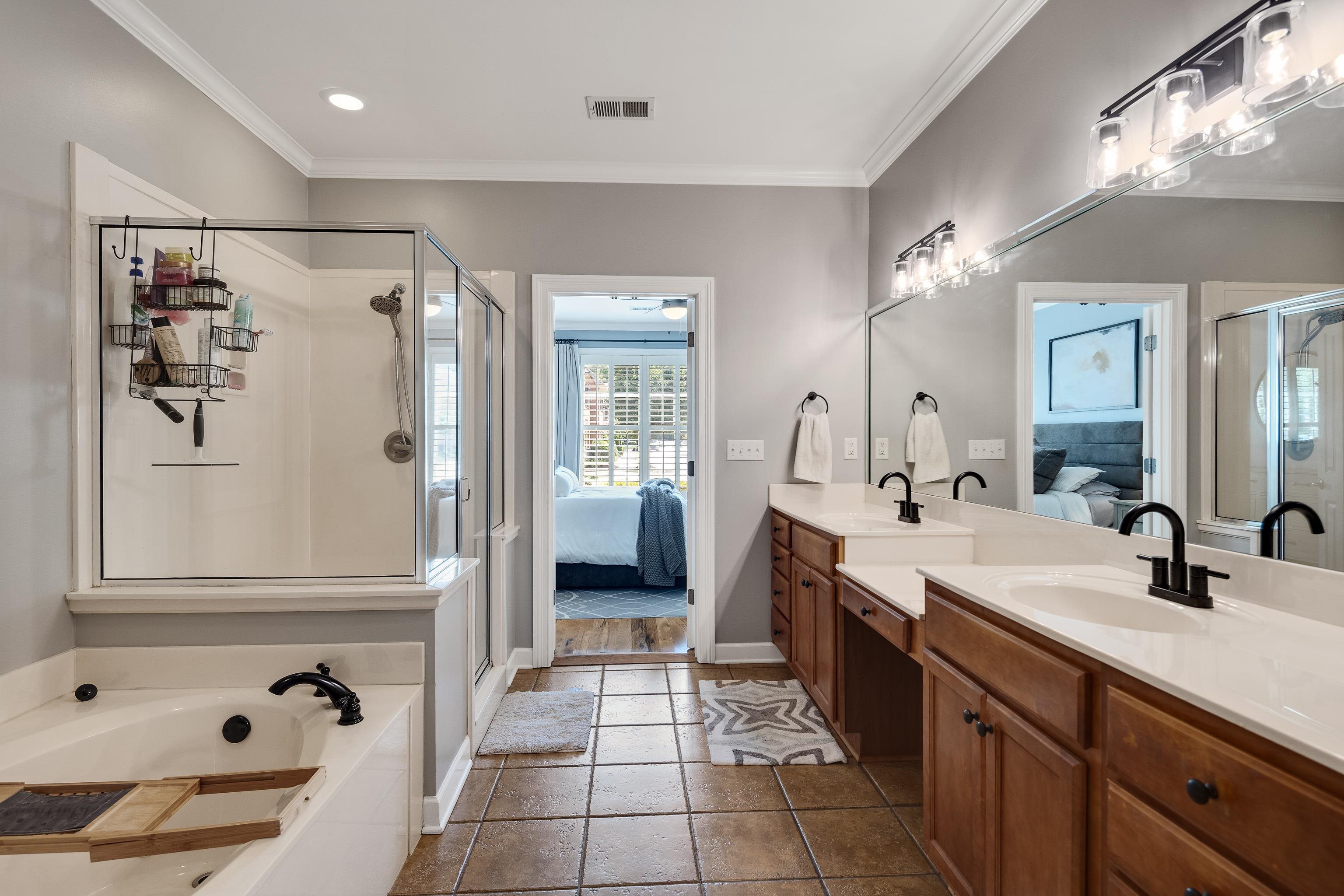 808 Deloach Lane Collierville, TN 38017 - Photo 19 of 40 a spacious bathroom with a tub sink and mirror