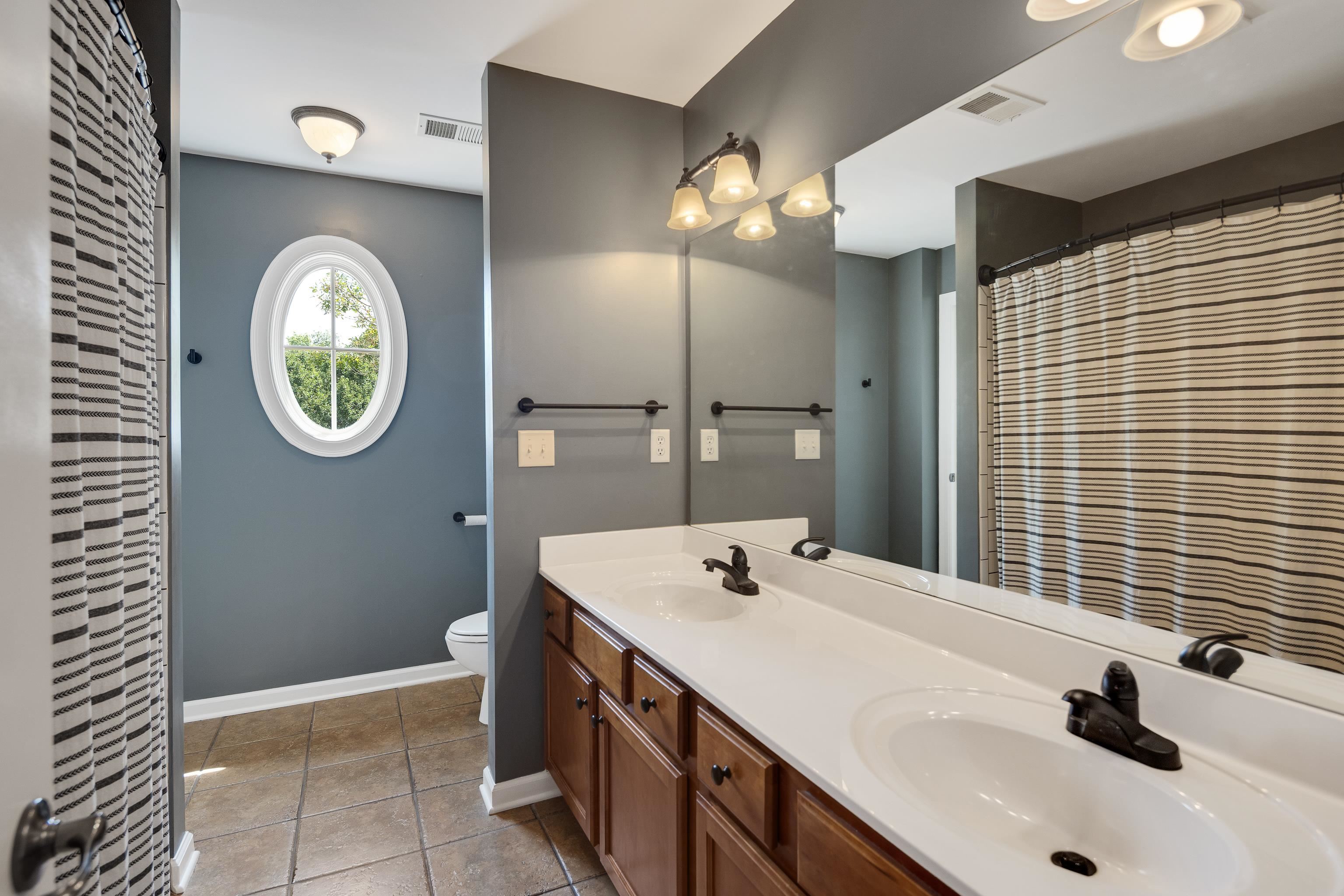 808 Deloach Lane Collierville, TN 38017 - Photo 25 of 40 a bathroom with a sink and a mirror