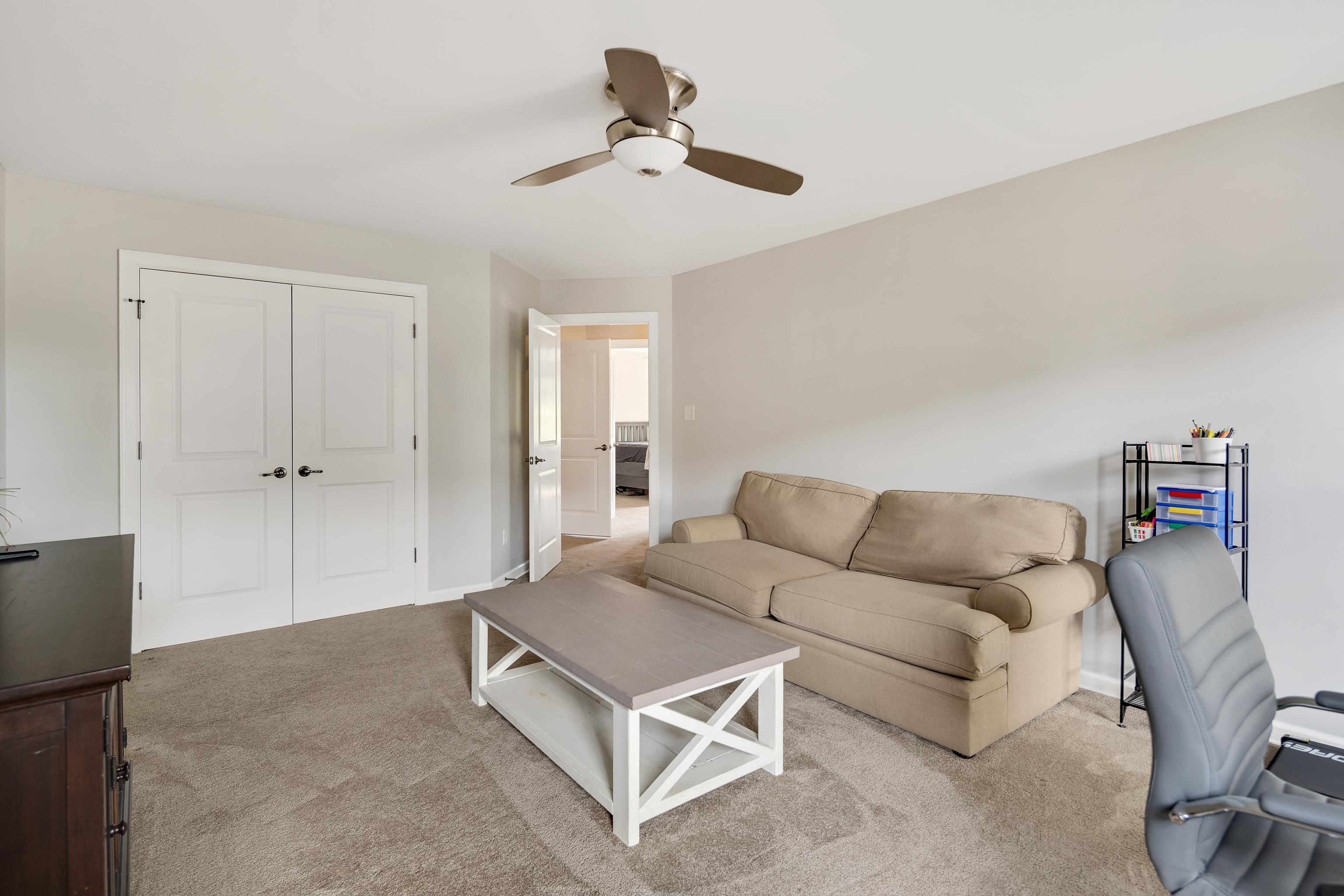 808 Deloach Lane Collierville, TN 38017 - Photo 29 of 40 a living room with furniture and a ceiling fan