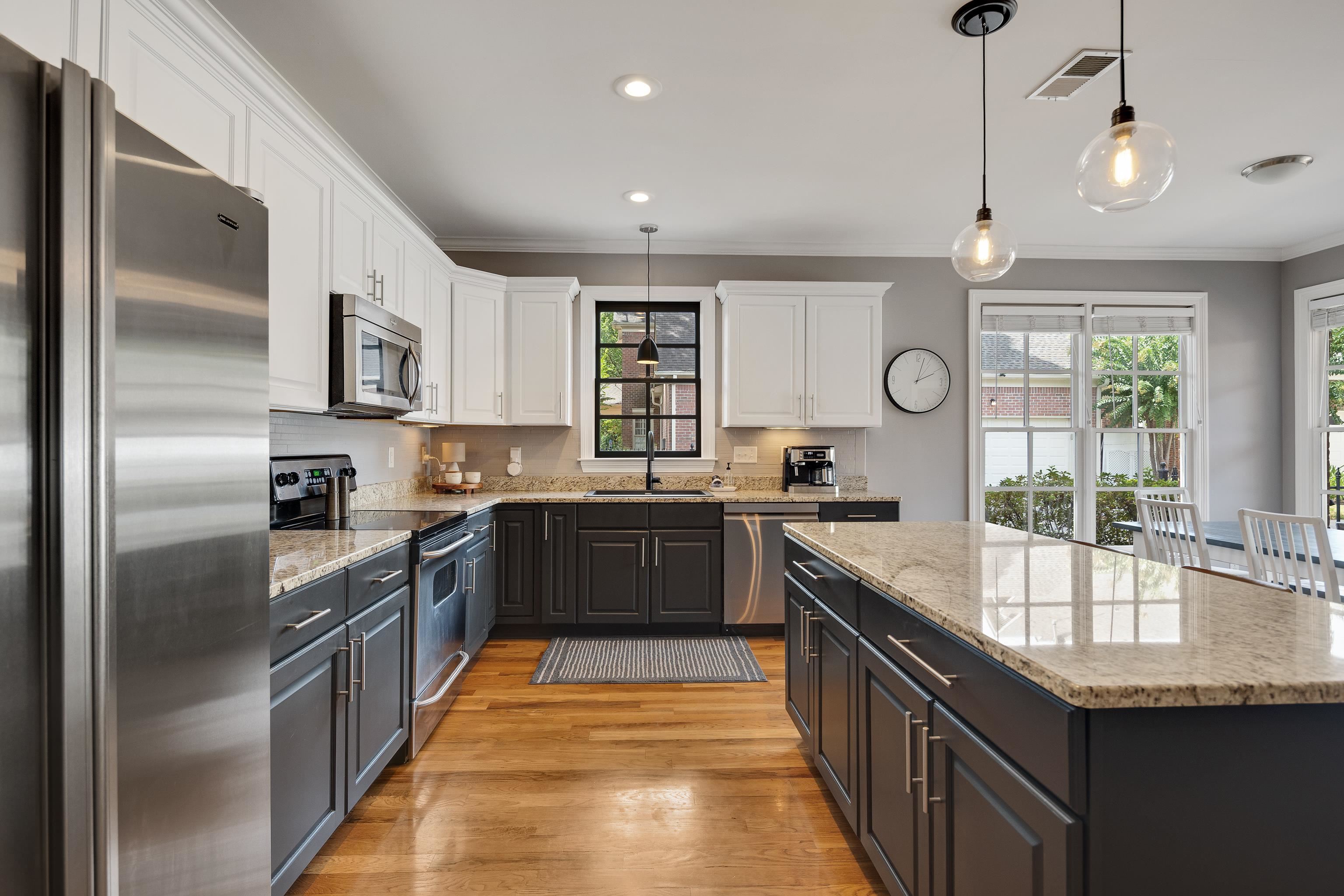 808 Deloach Lane Collierville, TN 38017 - Photo 9 of 40 a large kitchen with stainless steel appliances granite countertop a sink a counter top space cabinets and stainless steel appliances