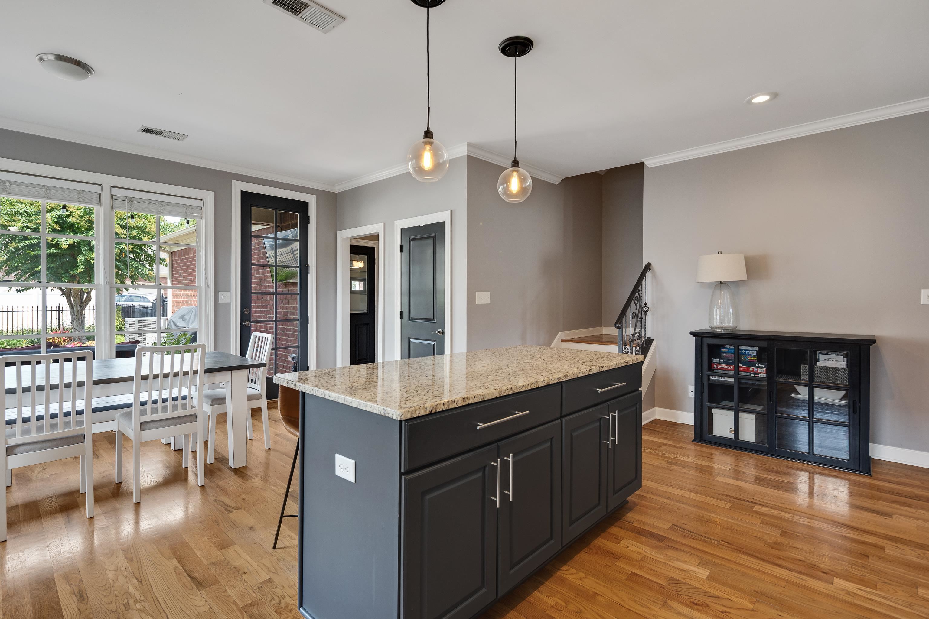 808 Deloach Lane Collierville, TN 38017 - Photo 10 of 40 a kitchen with stainless steel appliances granite countertop a sink a stove and a wooden floors
