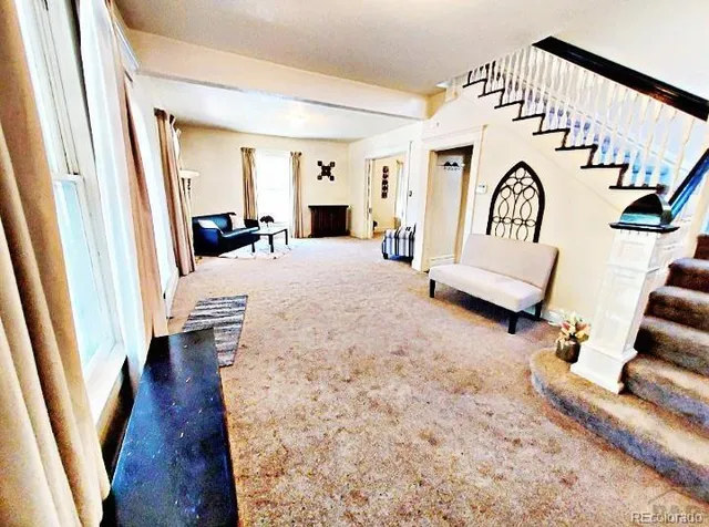 a view of living room and hardwood floor