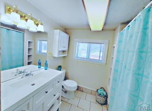 a bathroom with a sink a vanity and a mirror