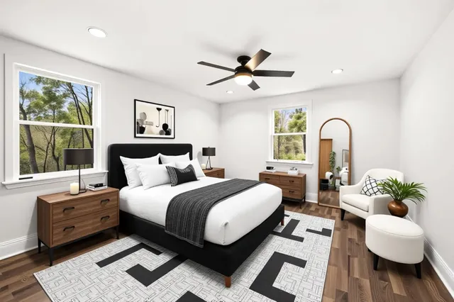 a bed room with a bed couch and a window