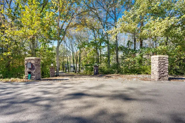 a view of a car parked in back yard of a house