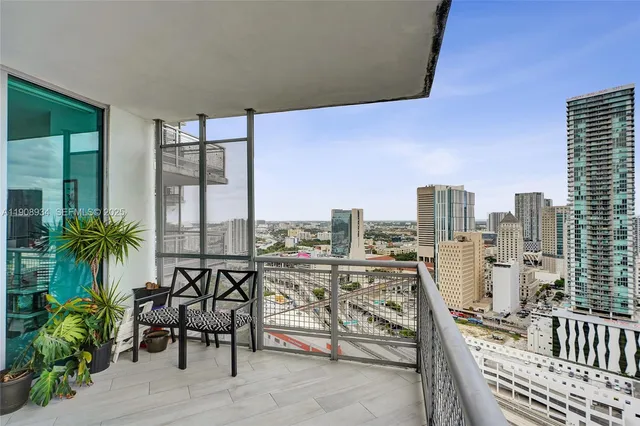 a view of balcony with furniture