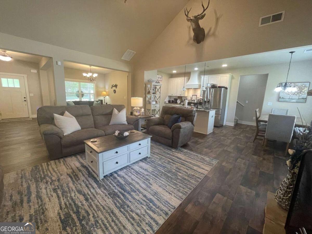 457 Old Good Hope Road Good Hope, GA 30641 - Photo 6 of 59 a living room with furniture and a chandelier