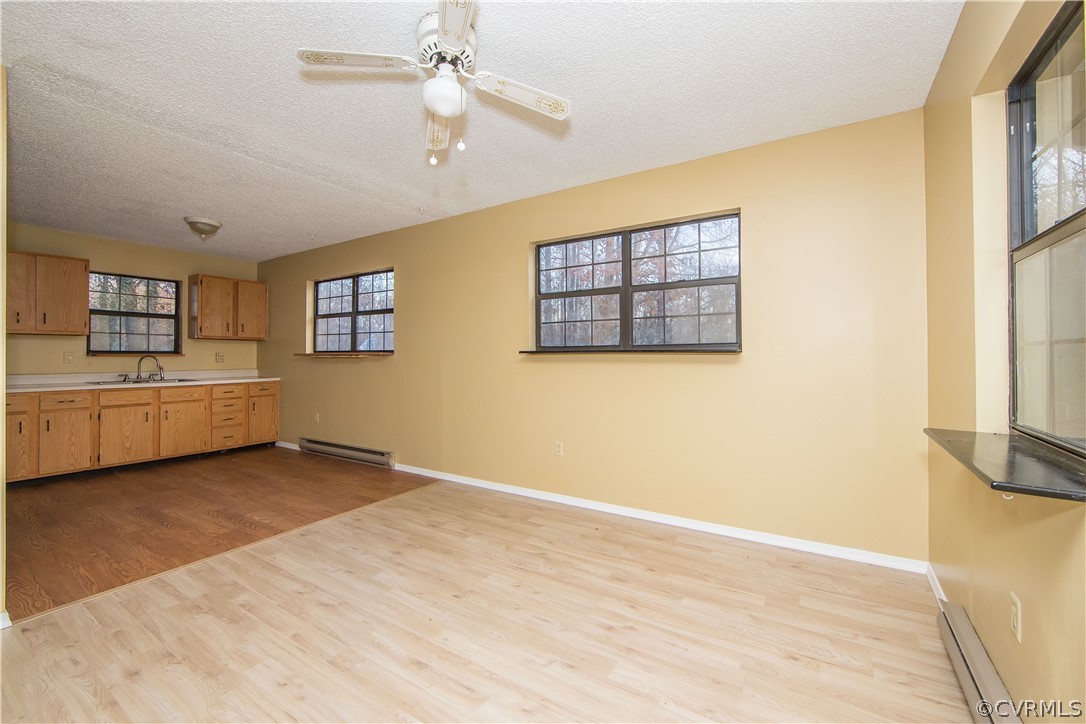 2255 Batterson Road Powhatan, VA 23139 - Photo 11 of 28 living room with large windows and overhead fan
