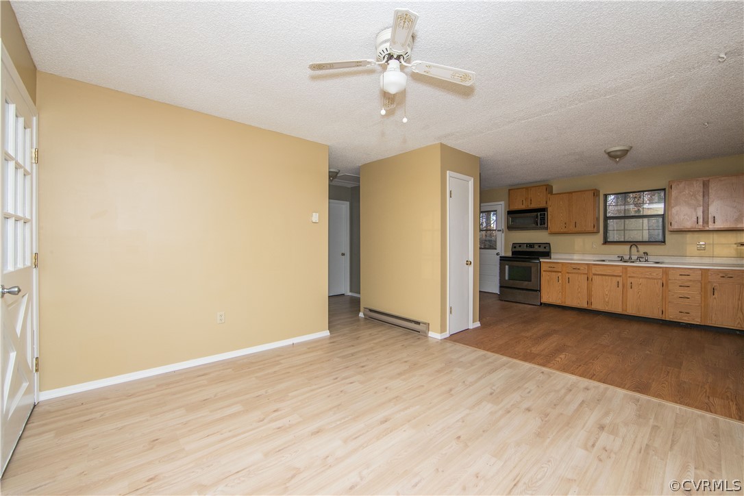 2255 Batterson Road Powhatan, VA 23139 - Photo 12 of 28 living room with large windows and overhead fan