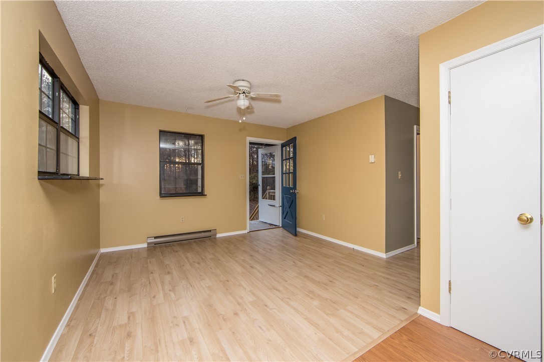 2255 Batterson Road Powhatan, VA 23139 - Photo 9 of 28 living room with large windows and overhead fan