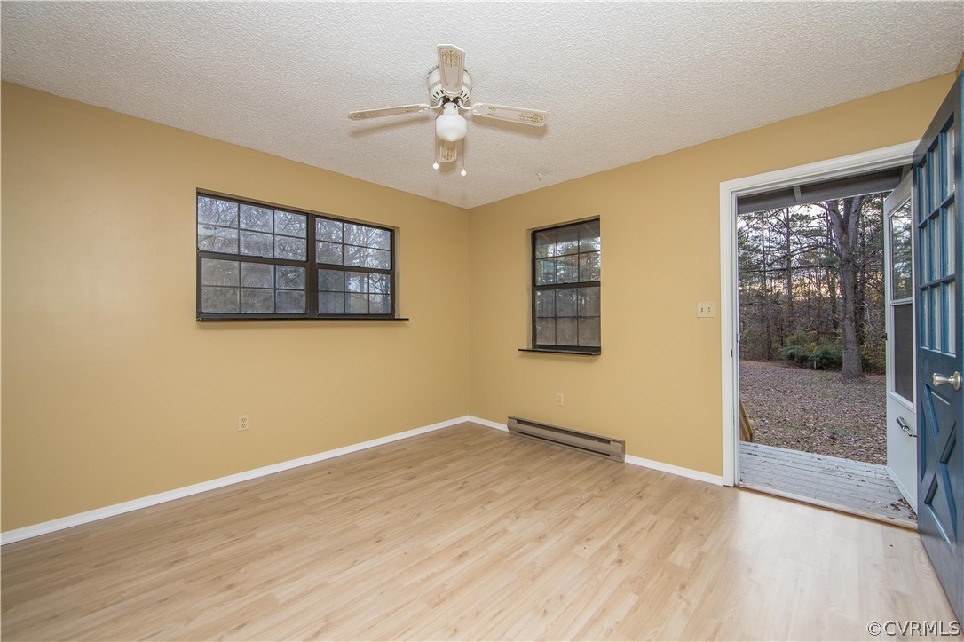 2255 Batterson Road Powhatan, VA 23139 - Photo 10 of 28 living room with large windows and overhead fan