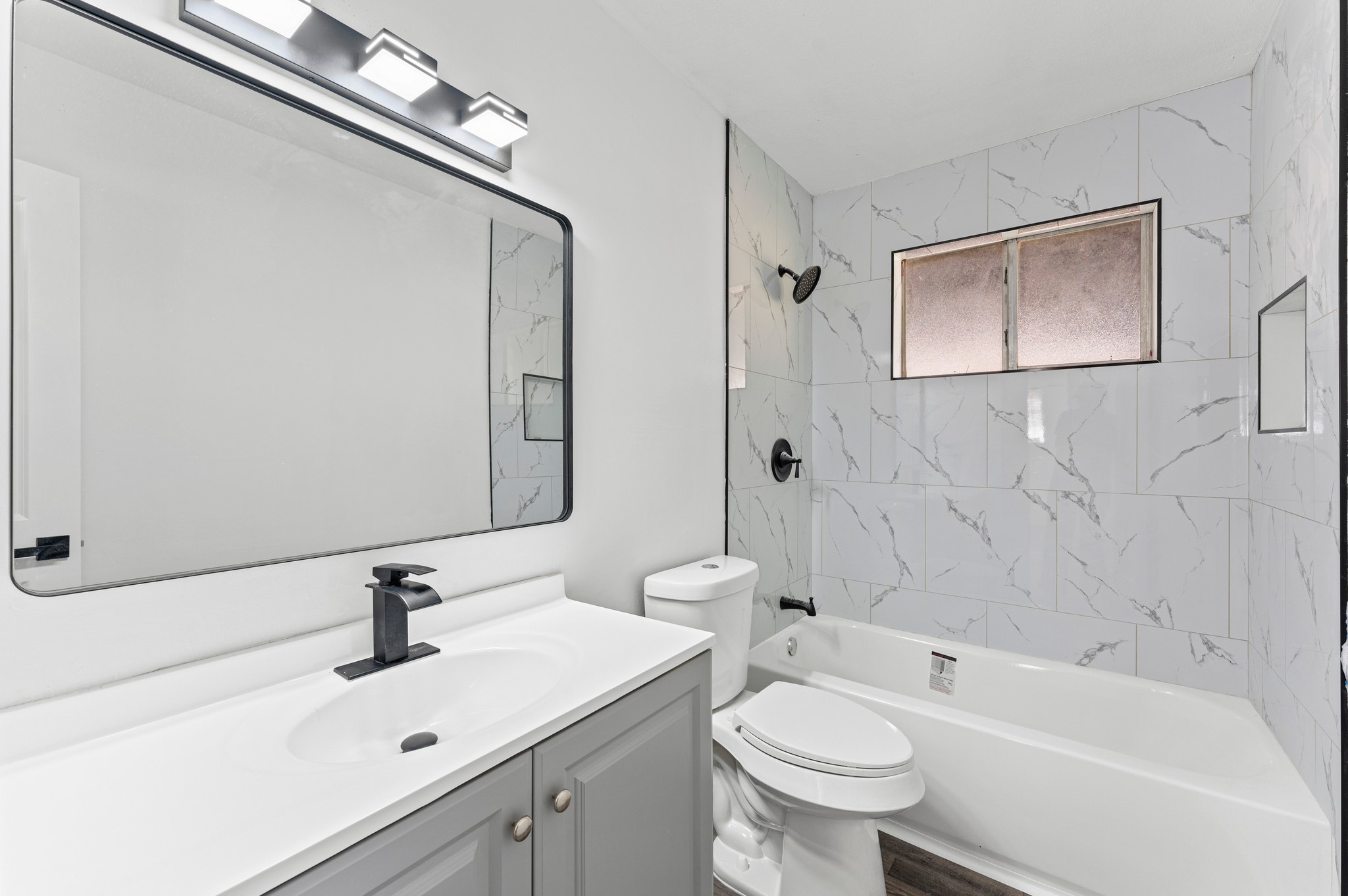 4519 Anice Street Houston, TX 77039 - Photo 13 of 25 a bathroom with a sink a toilet and shower