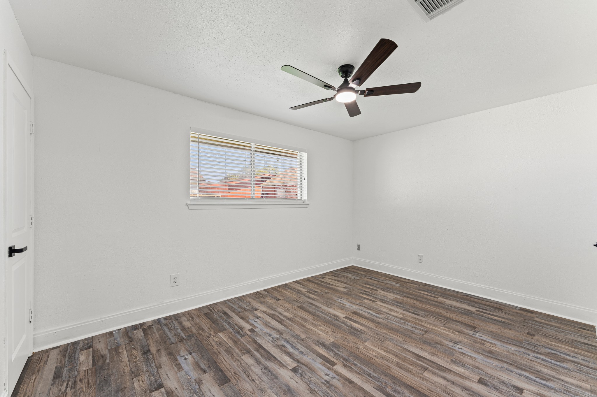4519 Anice Street Houston, TX 77039 - Photo 14 of 25 a view of empty room with wooden floor