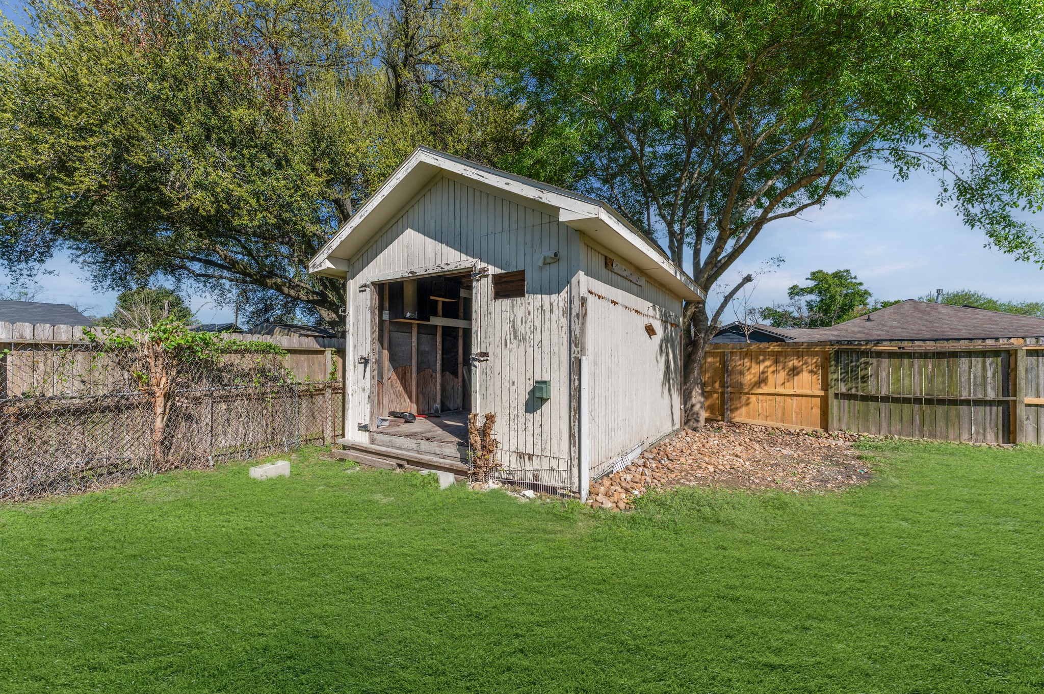 4519 Anice Street Houston, TX 77039 - Photo 20 of 25 a view of a house with a yard and a garden