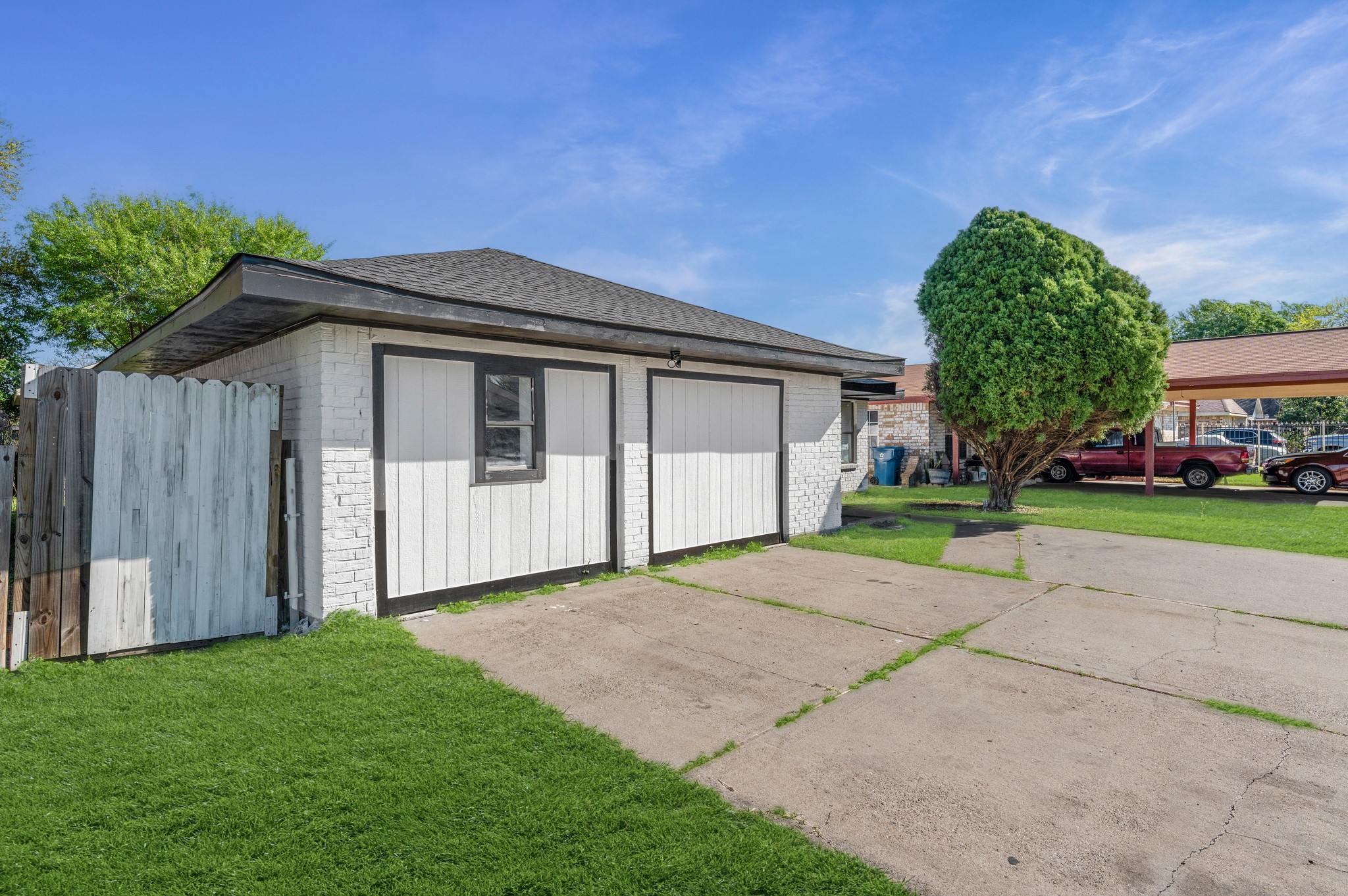 4519 Anice Street Houston, TX 77039 - Photo 24 of 25 a front view of a house with a yard and garage
