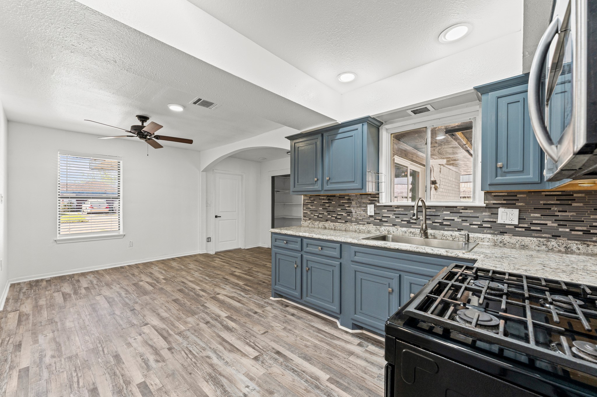 4519 Anice Street Houston, TX 77039 - Photo 3 of 25 a kitchen with a stove and a sink
