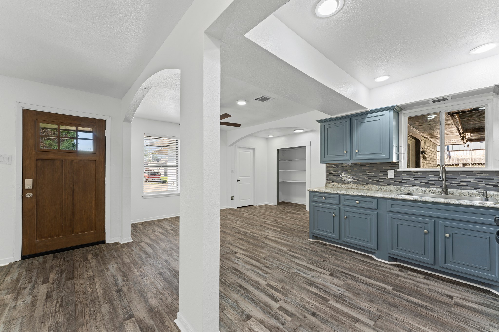 4519 Anice Street Houston, TX 77039 - Photo 5 of 25 a spacious bathroom with a granite countertop sink and a mirror