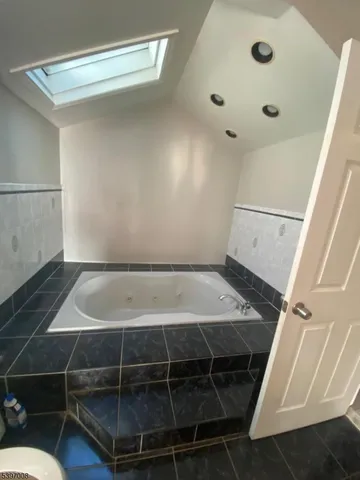 a room with water heater and a fan