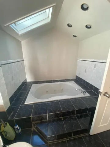 a room with water heater and white walls