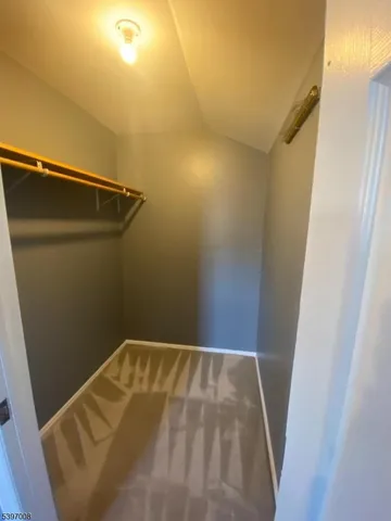 a kitchen with granite countertop a sink and a stove top oven