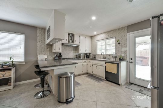 1267 North Erwin Street Ridgecrest, CA 93555 - Photo 2 of 35 a kitchen with a sink cabinets and window