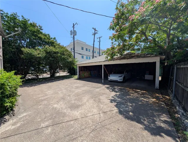 a view of a house with a yard and garage