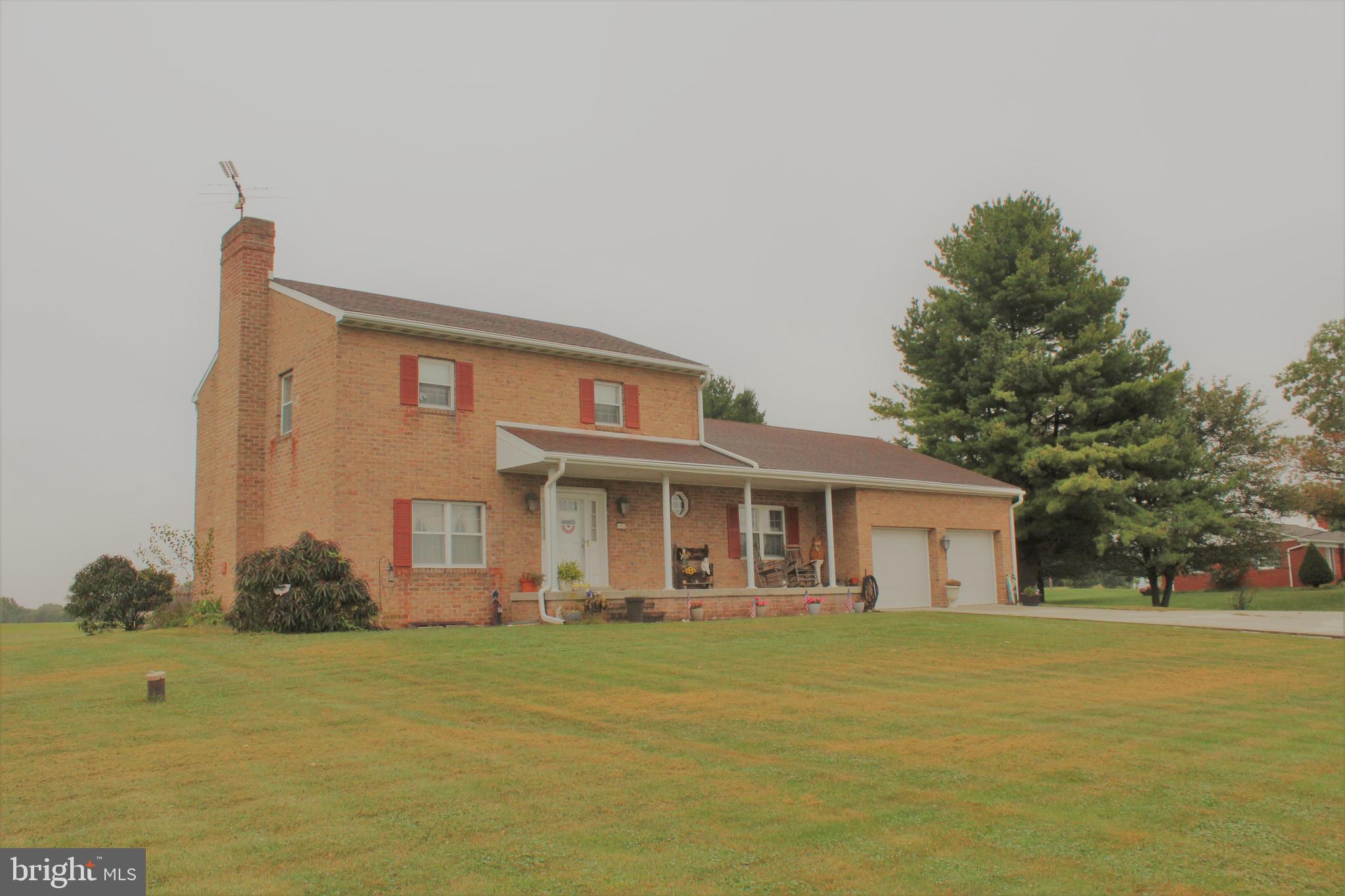 652 Cedar Ridge Road New Oxford, PA 17350 - Photo 2 of 17 a front view of a house with a garden