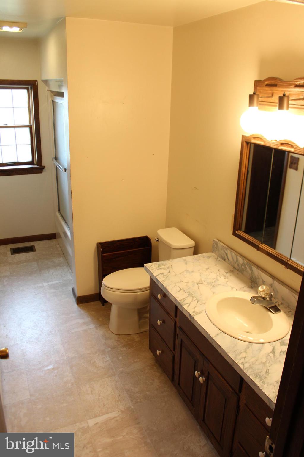 652 Cedar Ridge Road New Oxford, PA 17350 - Photo 13 of 17 a bathroom with a granite countertop sink and a mirror