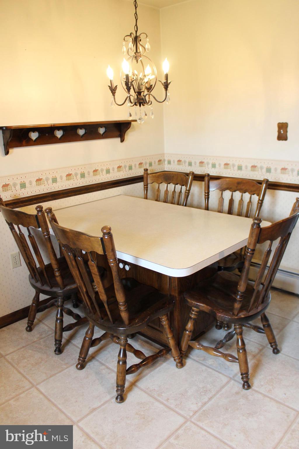 652 Cedar Ridge Road New Oxford, PA 17350 - Photo 10 of 17 a view of a dining room with furniture and chandelier