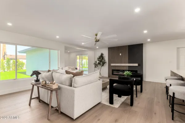 a living room with furniture and a large window