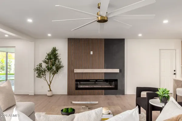 a living room with furniture and a fireplace