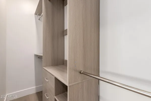 a view of an entryway with wooden floor